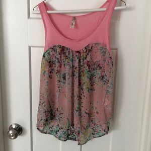 Pink tank top with sheer floral print on bottom